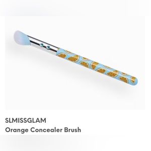 Concealer brush with cute orange pattern and rhinestone accents